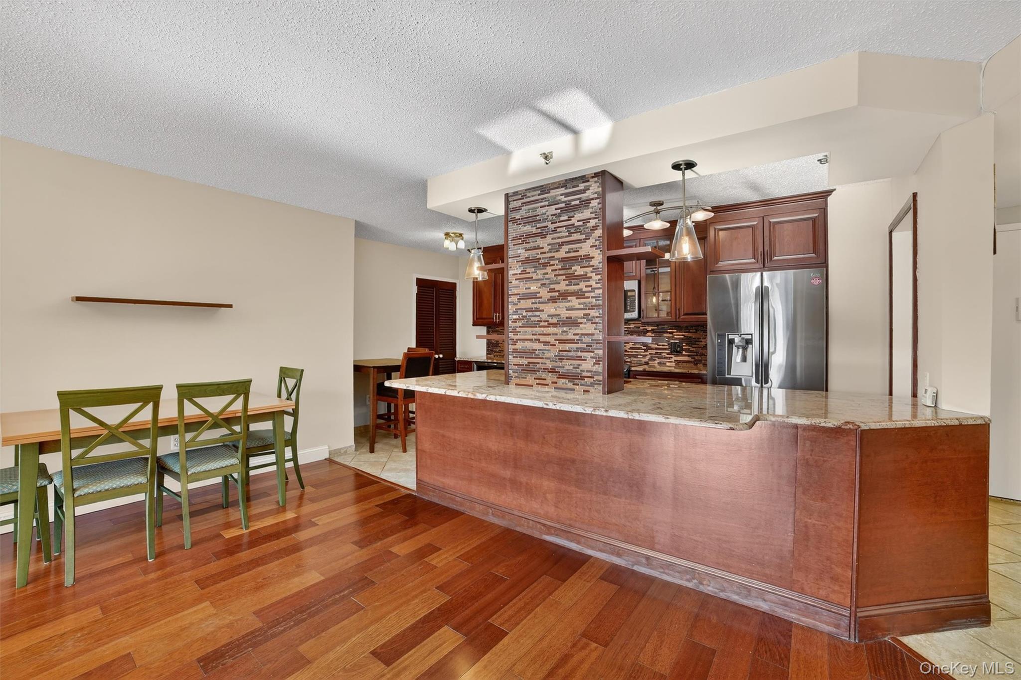 25 Rockledge Avenue, Unit 606 White Plains, NY 10601 - Photo 16 of 43 a open kitchen with stainless steel appliances granite countertop a stove and a refrigerator