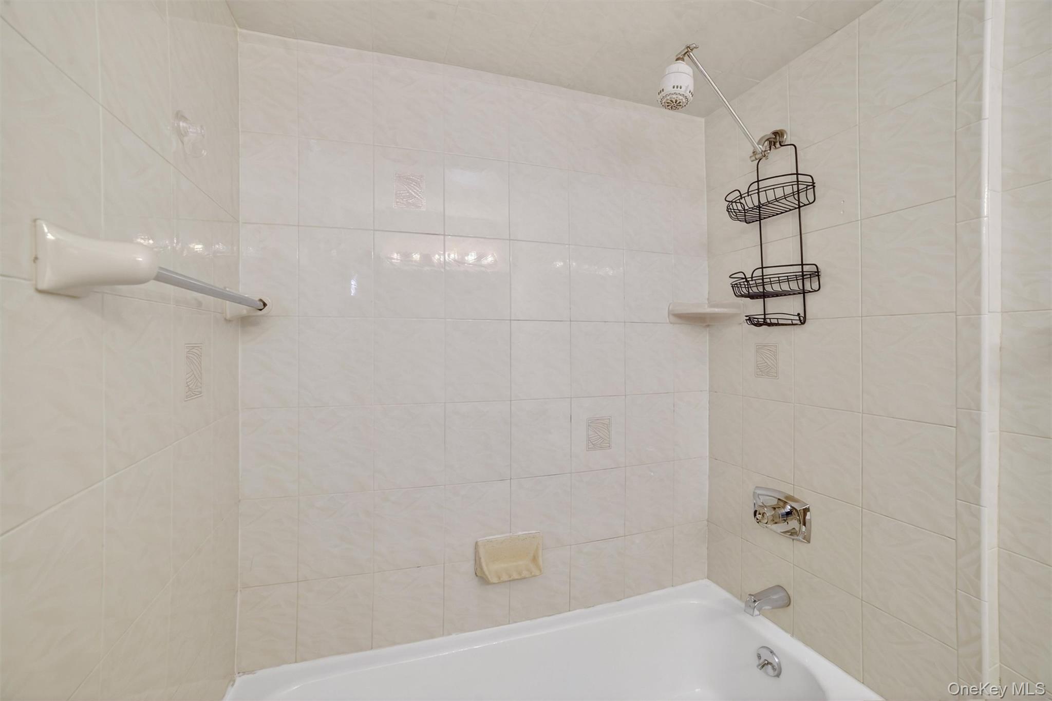25 Rockledge Avenue, Unit 606 White Plains, NY 10601 - Photo 20 of 43 a bathroom with a shower