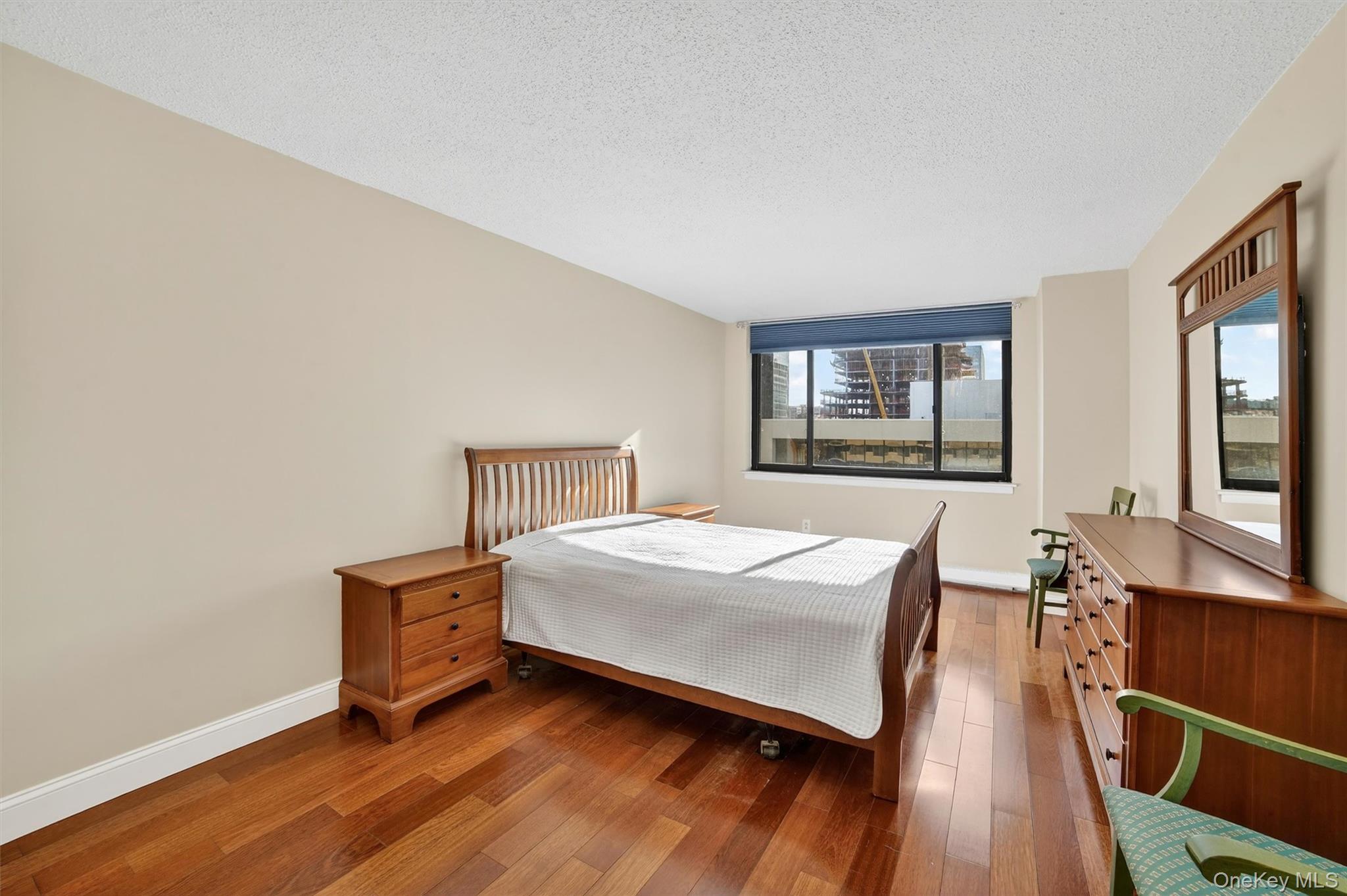 25 Rockledge Avenue, Unit 606 White Plains, NY 10601 - Photo 21 of 43 a bedroom with a bed and a large window