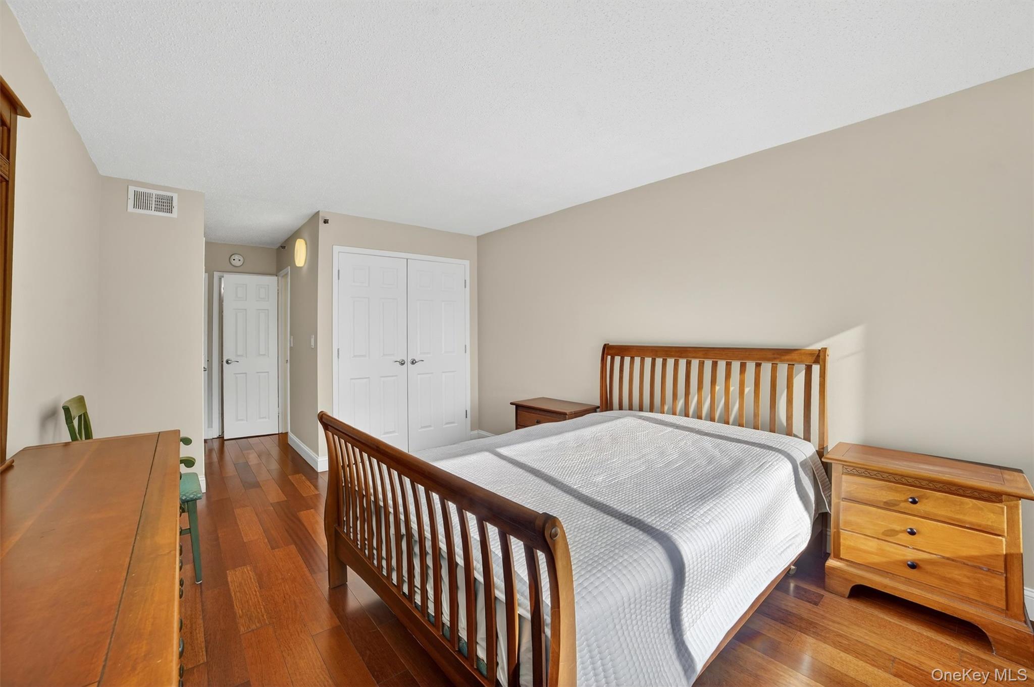25 Rockledge Avenue, Unit 606 White Plains, NY 10601 - Photo 22 of 43 a bedroom with a bed and a window