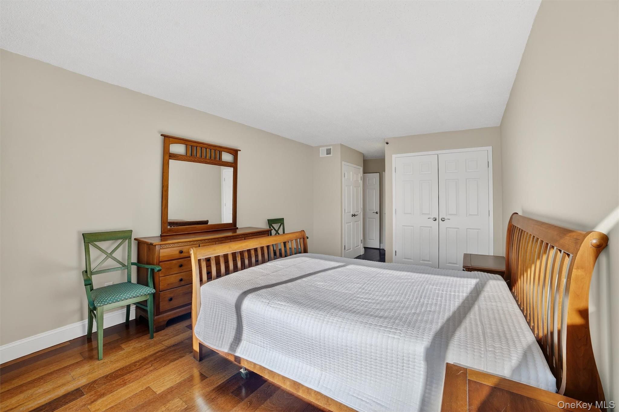 25 Rockledge Avenue, Unit 606 White Plains, NY 10601 - Photo 23 of 43 a bedroom with a bed and a dresser