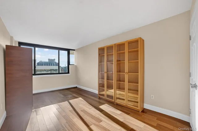 a view of livingroom with furniture wooden floor and front door