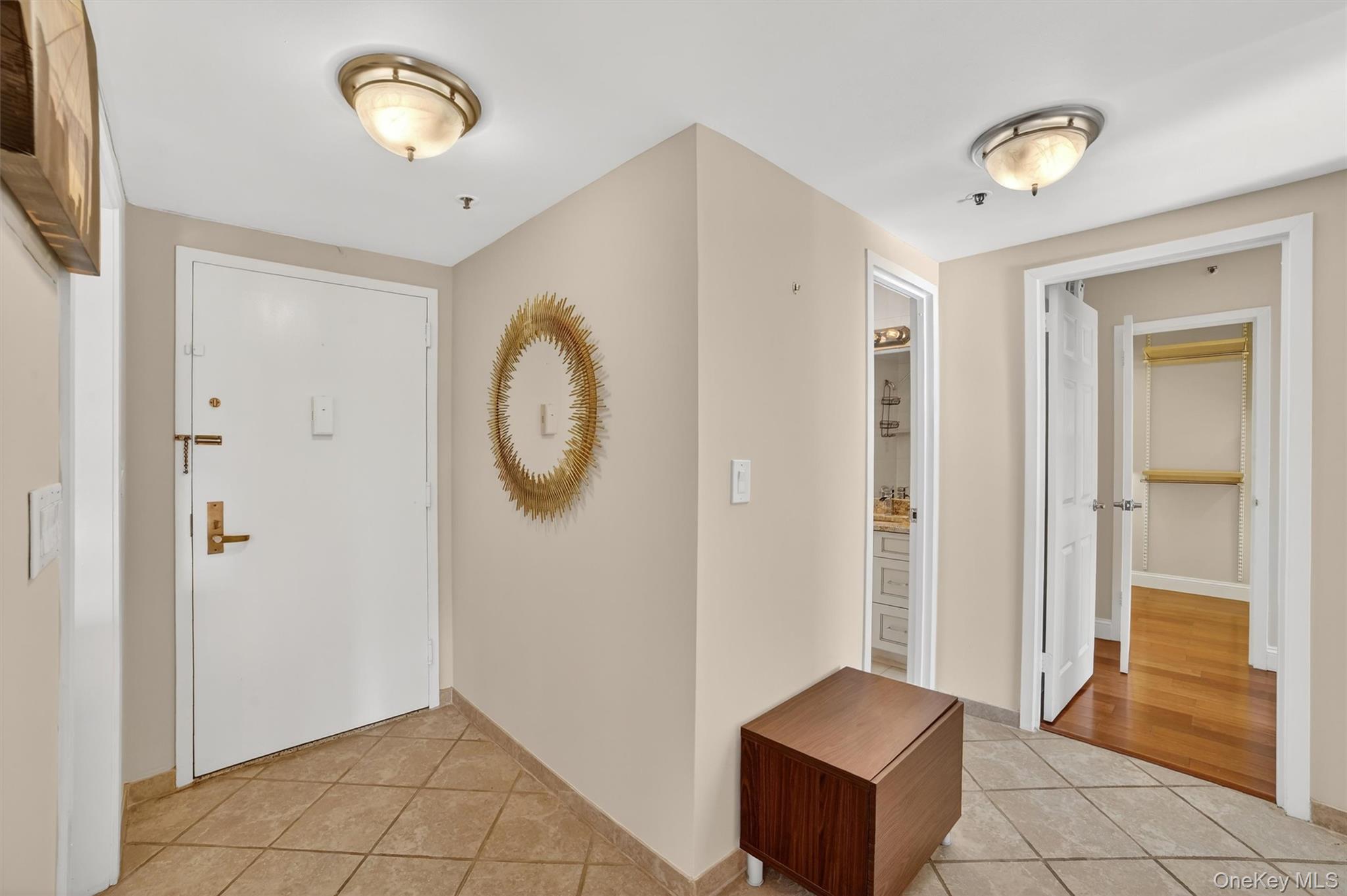 25 Rockledge Avenue, Unit 606 White Plains, NY 10601 - Photo 6 of 43 a view of room with window and a chandelier