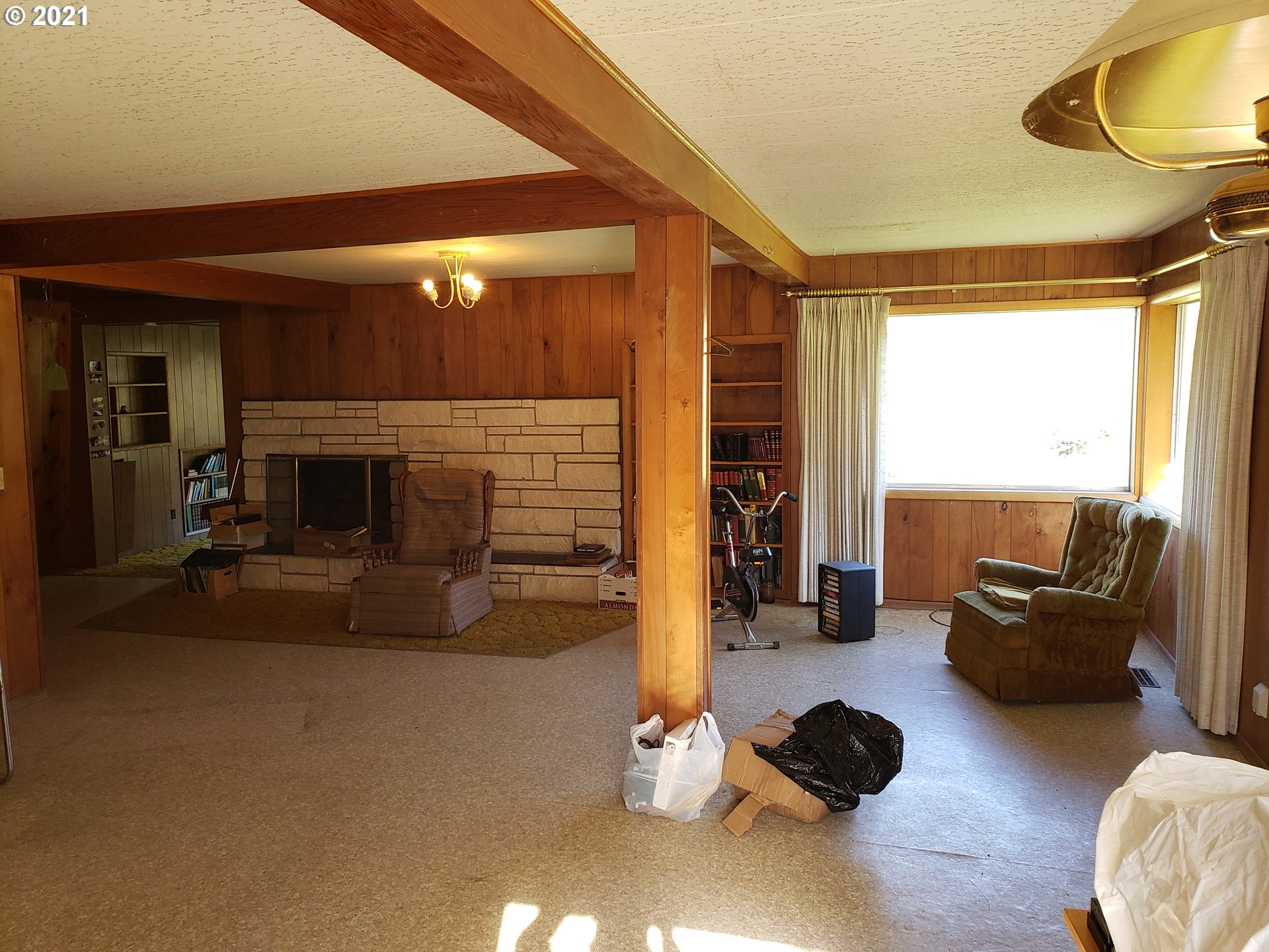 403 Meyer Lane Riddle, OR 97469 - Photo 17 of 25 a living room with furniture and a fireplace