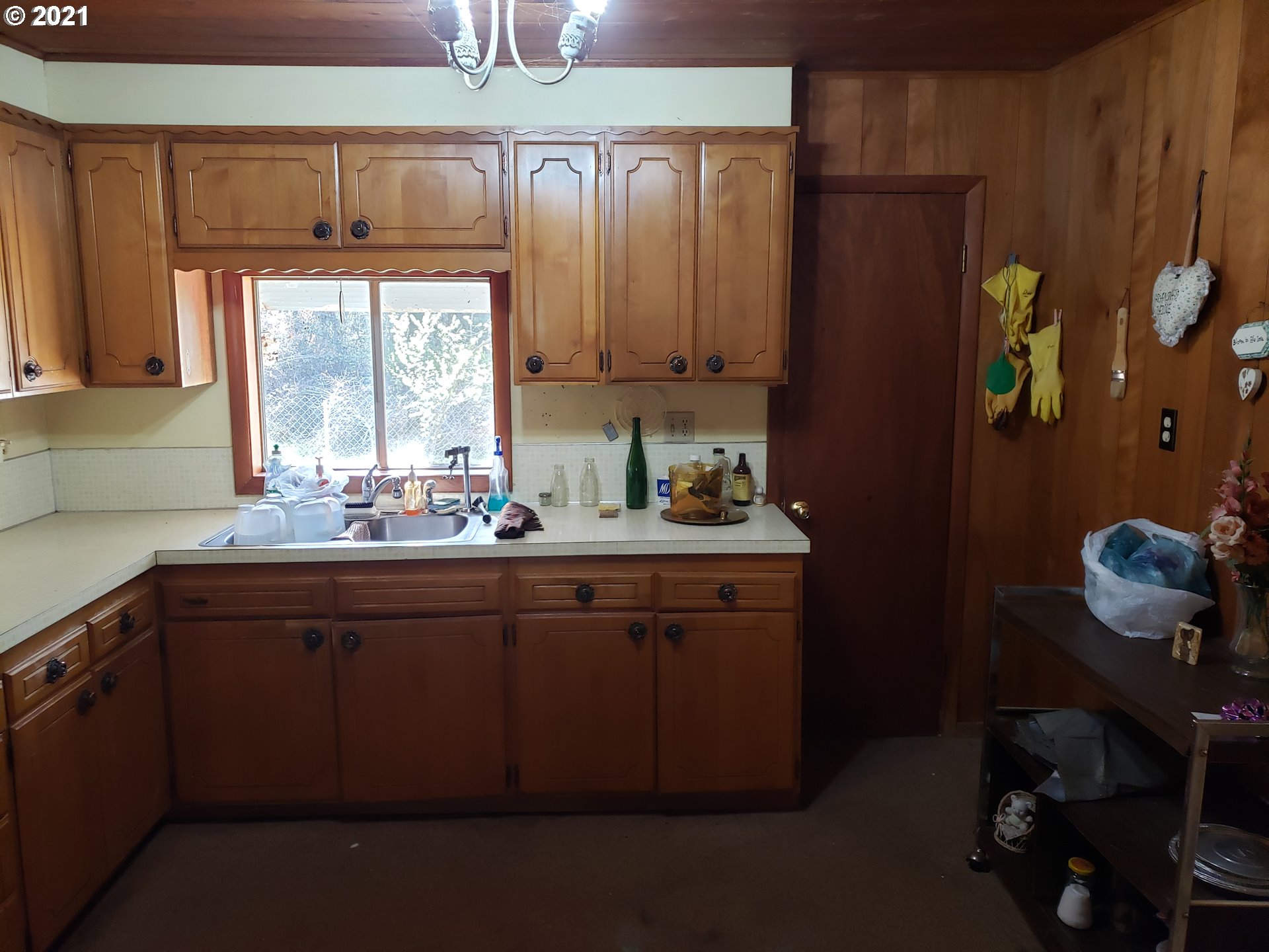 403 Meyer Lane Riddle, OR 97469 - Photo 21 of 25 a kitchen with a sink window and cabinets