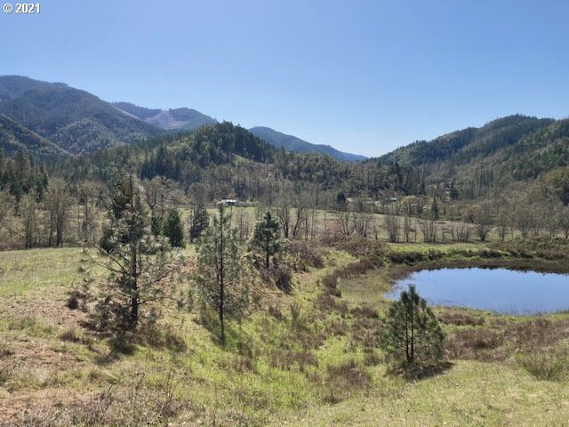 403 Meyer Lane Riddle, OR 97469 - Photo 4 of 25 a view of lake with mountain