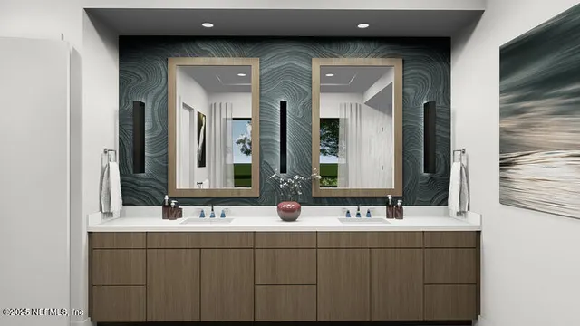 a bathroom with double vanity sinks and a mirror