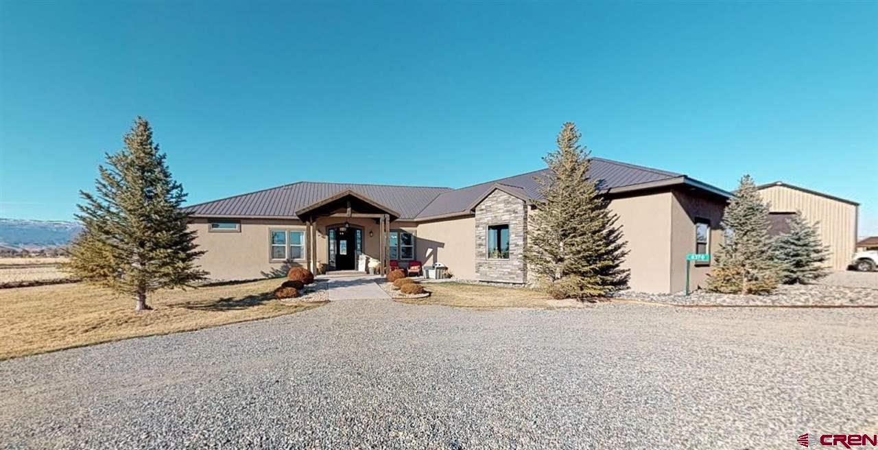 8370 2000th Road Austin, CO 81410 - Photo 1 of 35 a view of a house with a yard