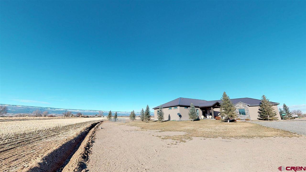 8370 2000th Road Austin, CO 81410 - Photo 2 of 35 a view of a terrace with water view