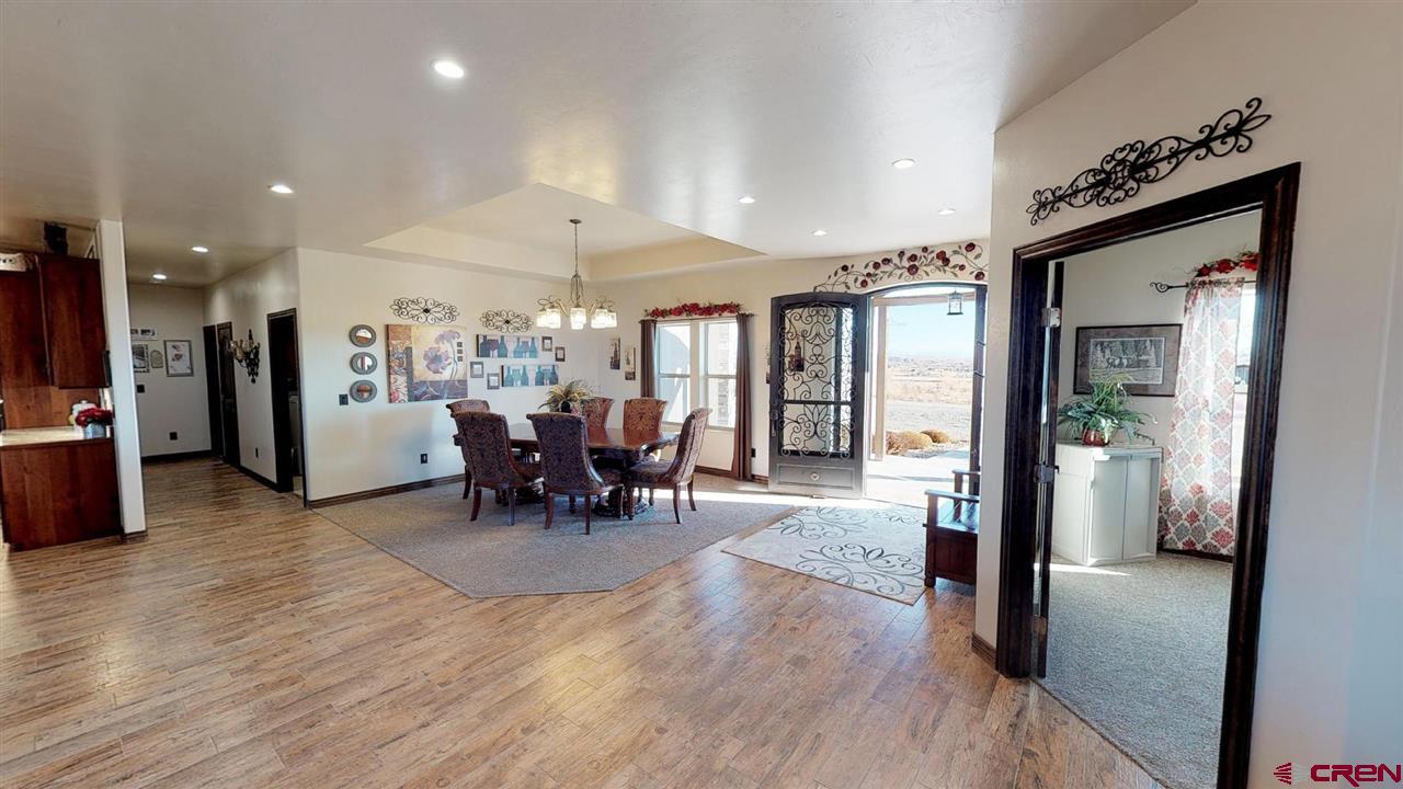 8370 2000th Road Austin, CO 81410 - Photo 11 of 35 a view of a dining room with furniture window and wooden floor
