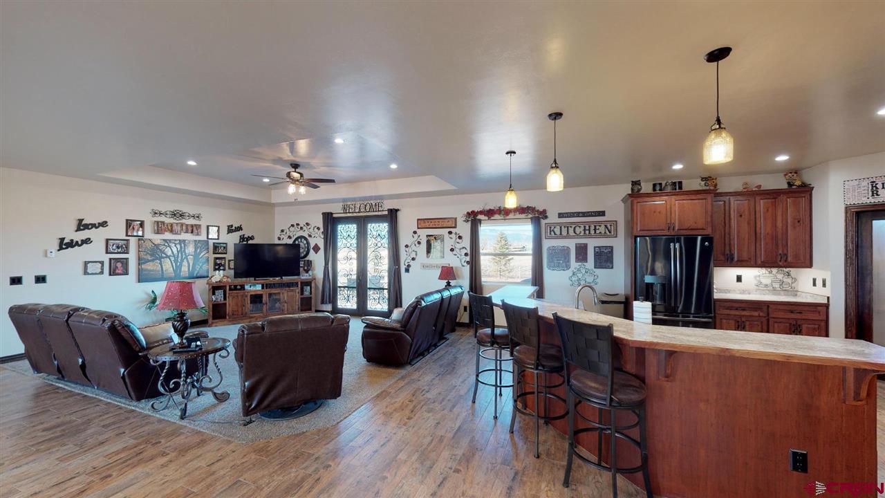 8370 2000th Road Austin, CO 81410 - Photo 14 of 35 a view of a dining room with furniture window and wooden floor