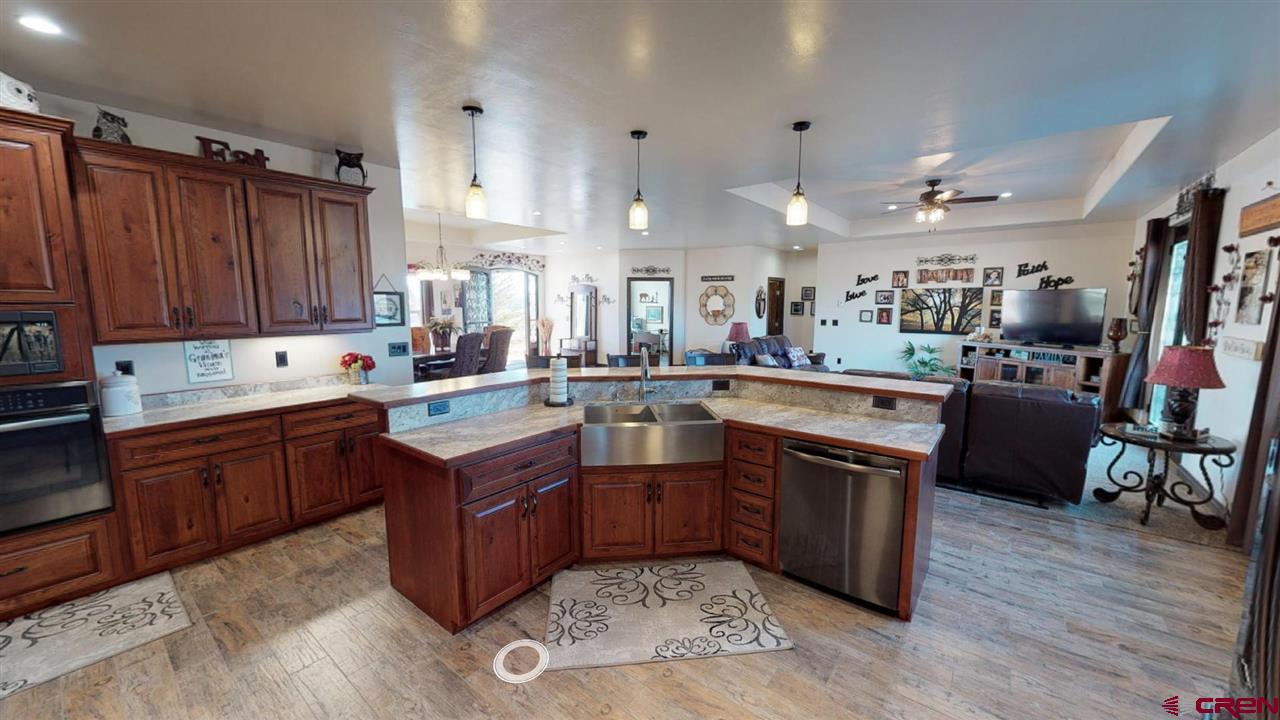 8370 2000th Road Austin, CO 81410 - Photo 15 of 35 a kitchen with lots of counter top space appliances and cabinets