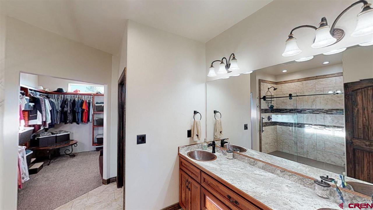 8370 2000th Road Austin, CO 81410 - Photo 21 of 35 a kitchen with refrigerator and countertop