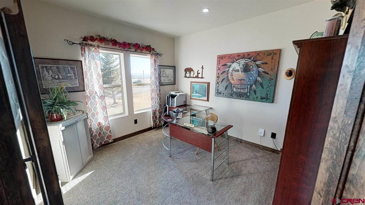 8370 2000th Road Austin, CO 81410 - Photo 23 of 35 a living room with furniture and a window