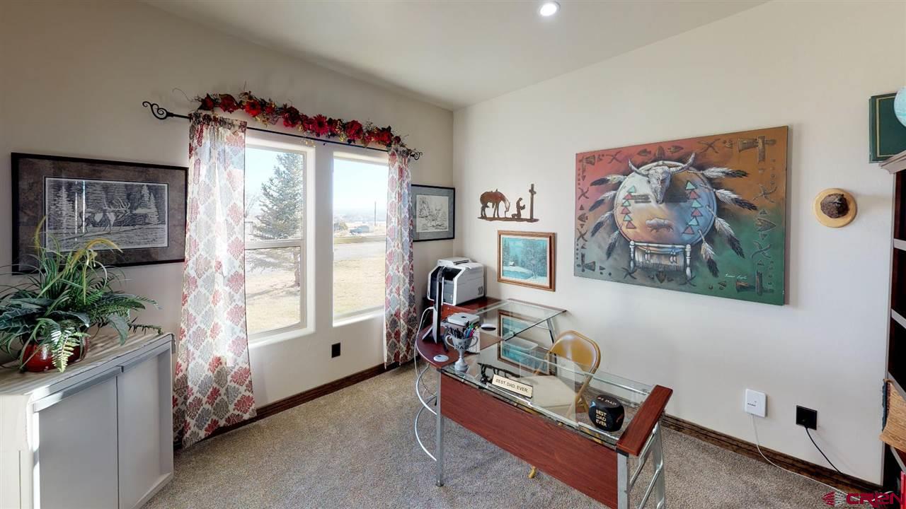 8370 2000th Road Austin, CO 81410 - Photo 29 of 35 a living room with furniture and a large window