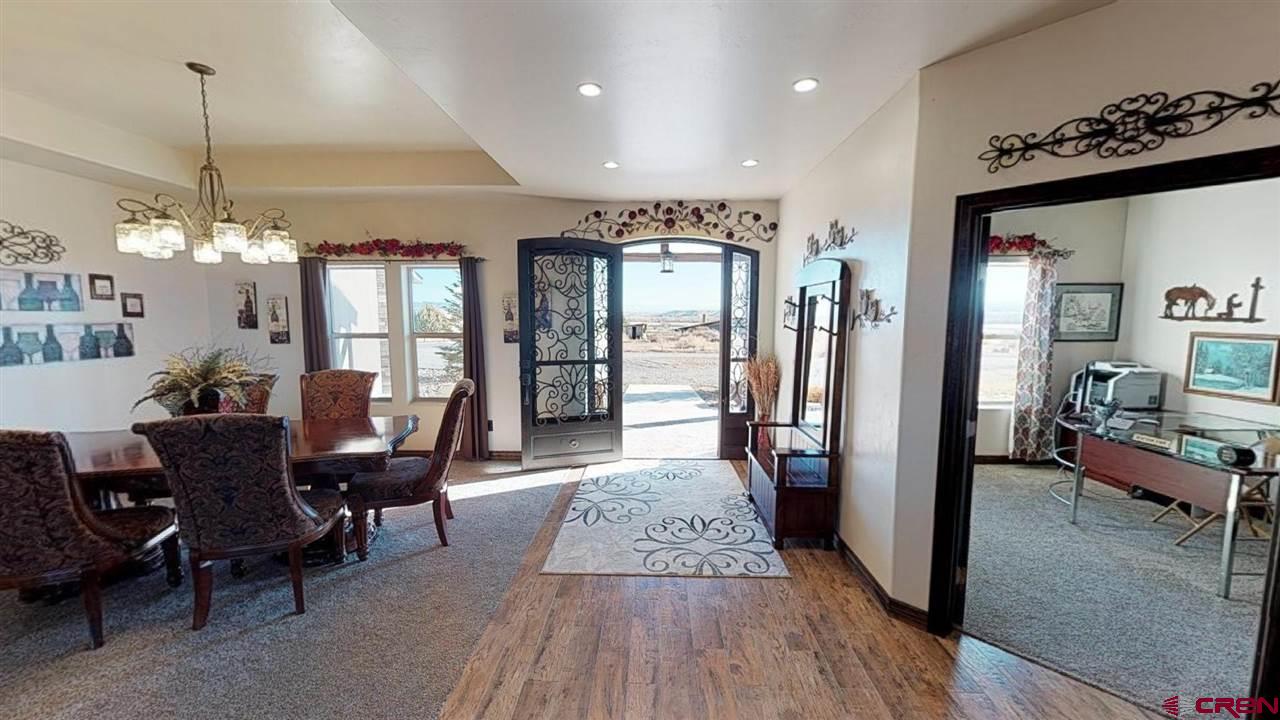8370 2000th Road Austin, CO 81410 - Photo 9 of 35 a view of a dining room with furniture window and wooden floor