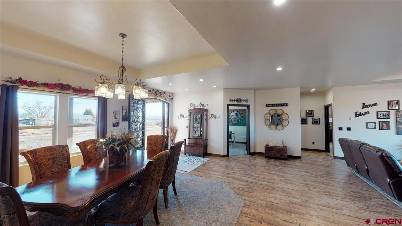 8370 2000th Road Austin, CO 81410 - Photo 10 of 35 a view of a dining room with furniture and chandelier