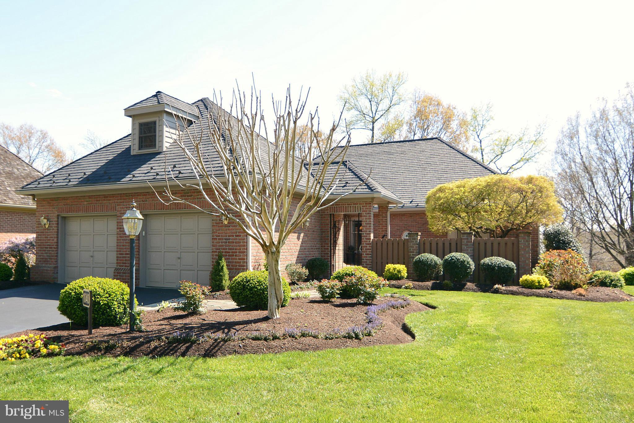 1040 South River Landing Road, Unit 1040 Edgewater, MD 21037 - Photo 1 of 30 a front view of a house with garden