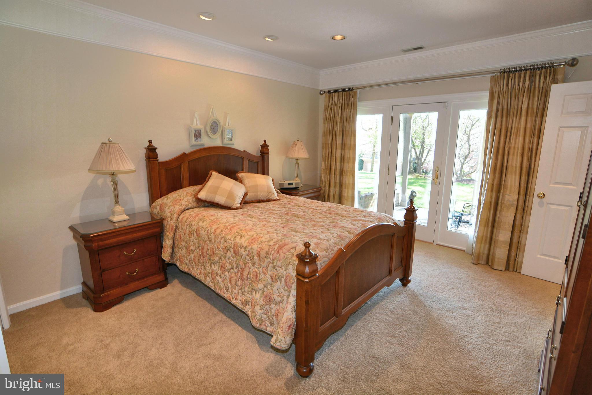 1040 South River Landing Road, Unit 1040 Edgewater, MD 21037 - Photo 22 of 30 a bedroom with a bed and a large window