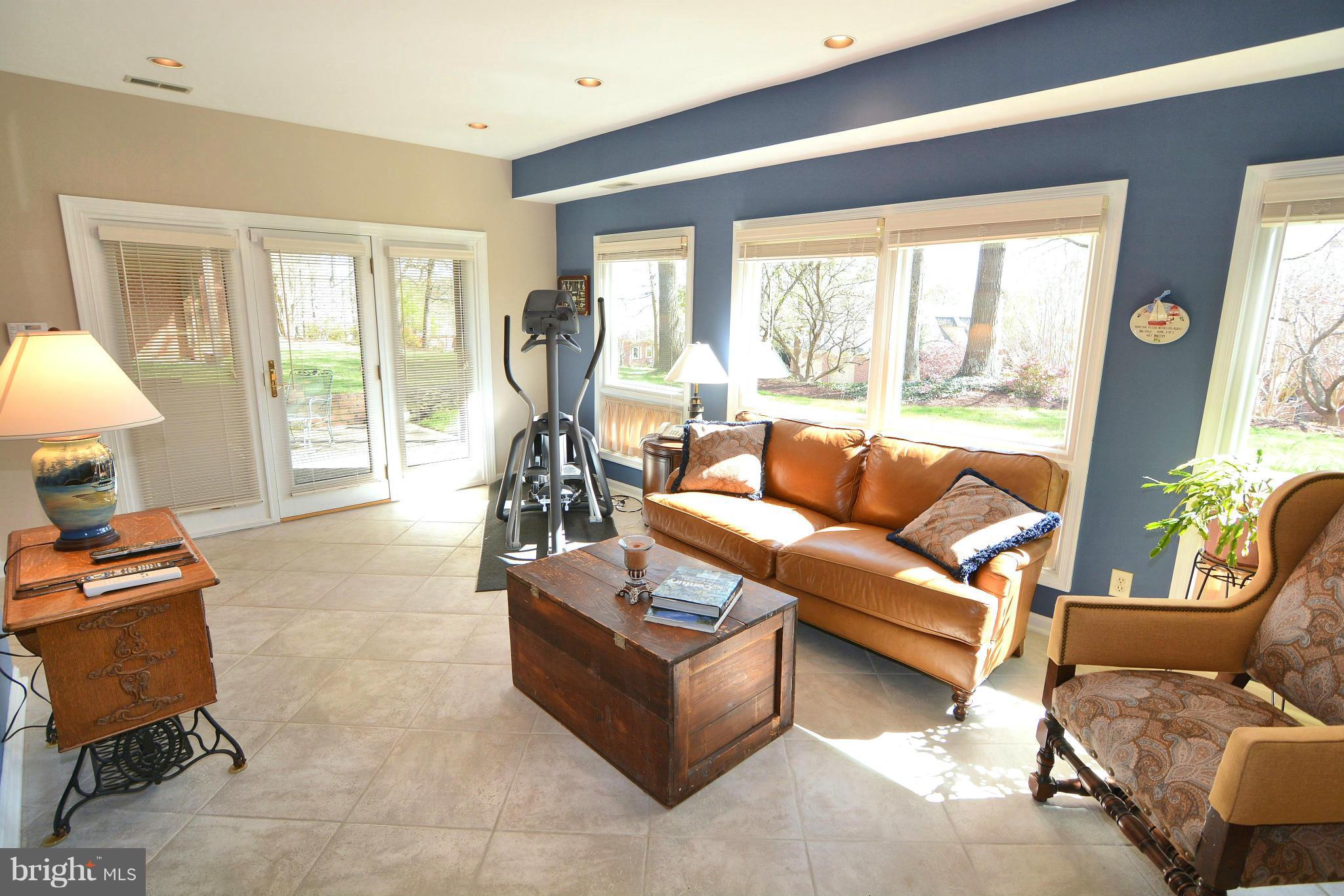 1040 South River Landing Road, Unit 1040 Edgewater, MD 21037 - Photo 25 of 30 a living room with furniture and a large window