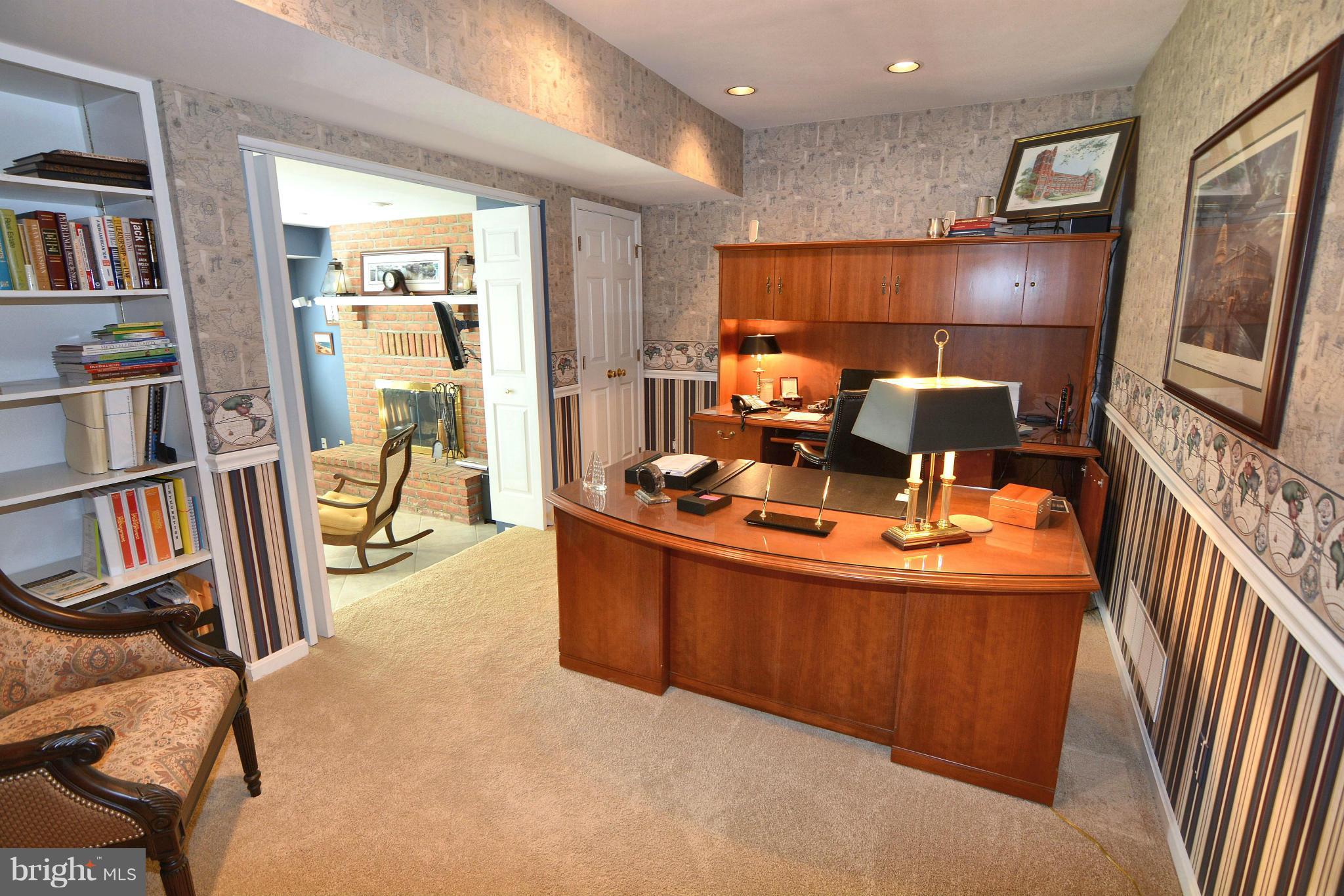 1040 South River Landing Road, Unit 1040 Edgewater, MD 21037 - Photo 26 of 30 a living room with fireplace furniture and a flat screen tv