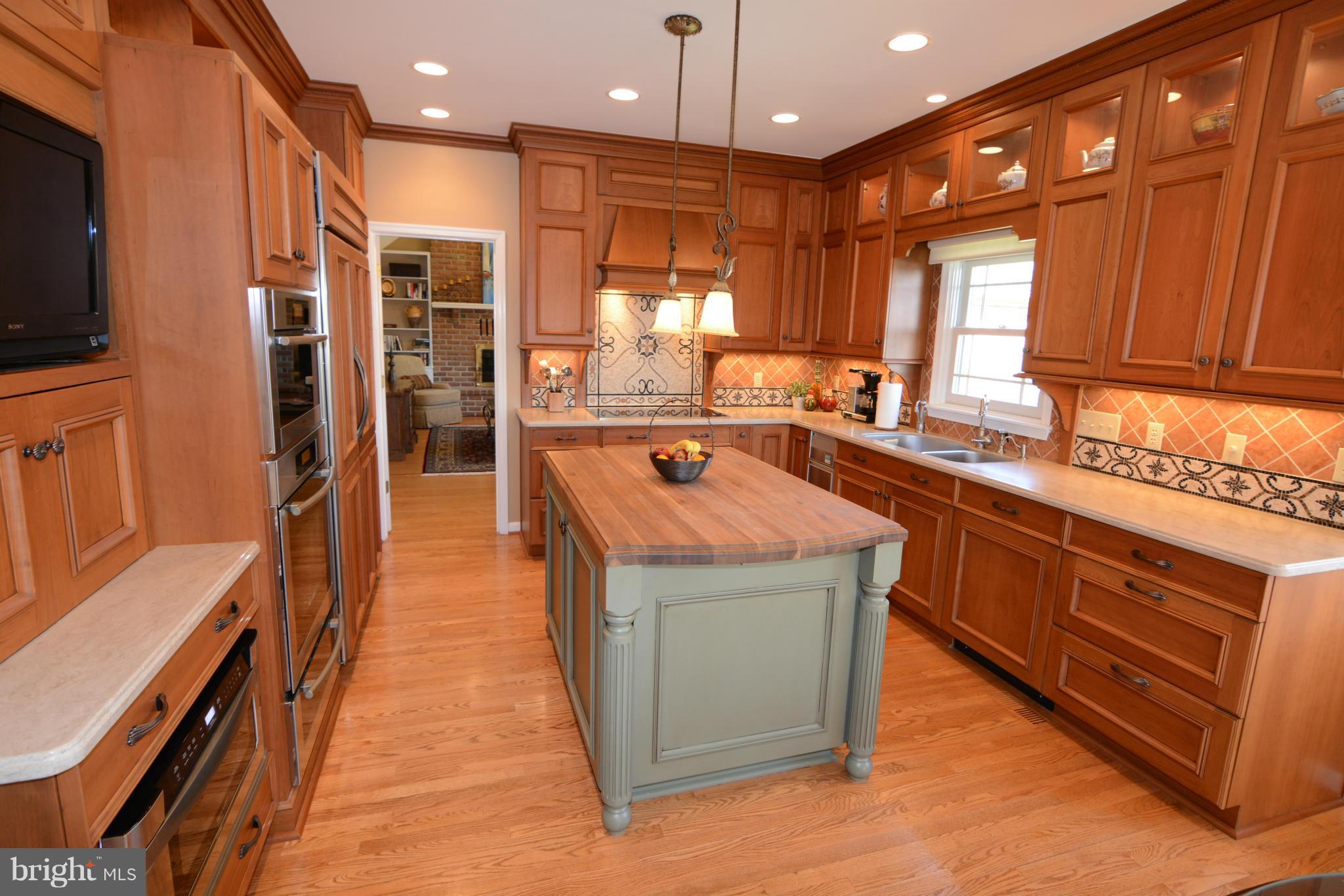 1040 South River Landing Road, Unit 1040 Edgewater, MD 21037 - Photo 5 of 30 a kitchen with stainless steel appliances granite countertop a stove a sink and a microwave