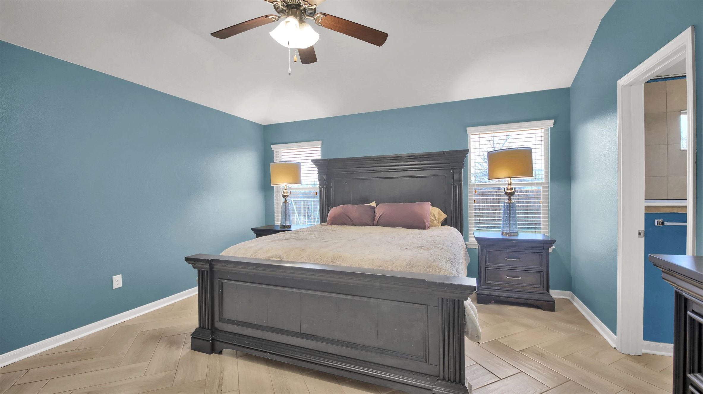 18005 Moreto Loop Pflugerville, TX 78660 - Photo 19 of 25 Bedroom featuring parquet floors, ceiling fan, and lofted ceiling