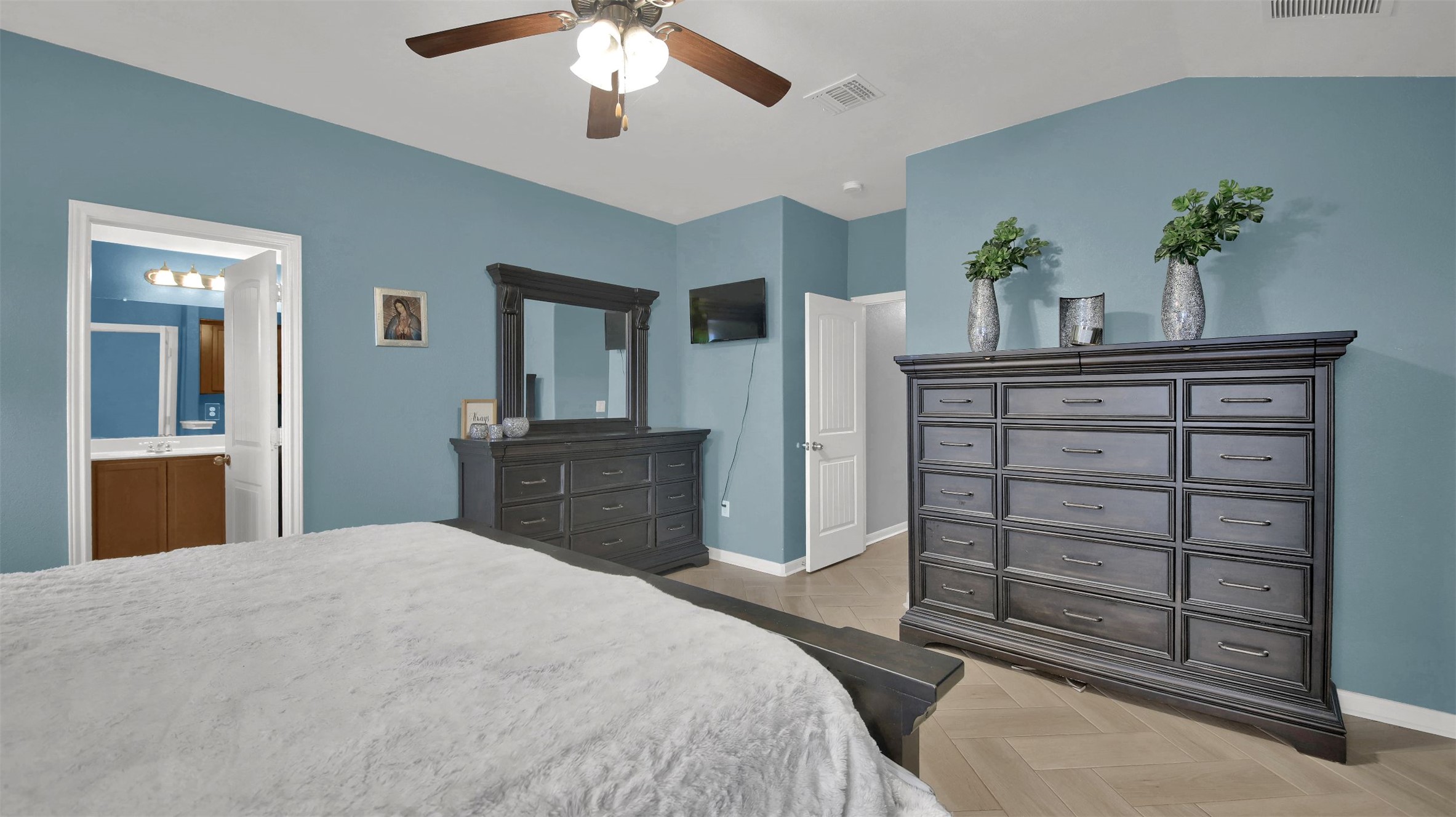 18005 Moreto Loop Pflugerville, TX 78660 - Photo 20 of 25 Bedroom with parquet flooring and a ceiling fan