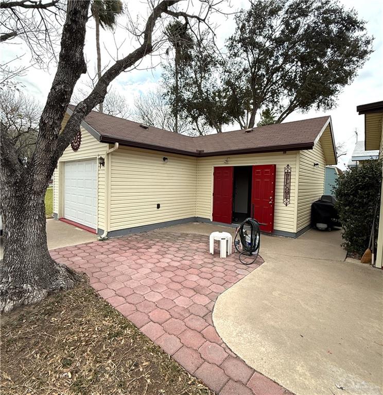 101 Rim Drive Mission, TX 78574 - Photo 17 of 17 a front view of a house with yard and seating area