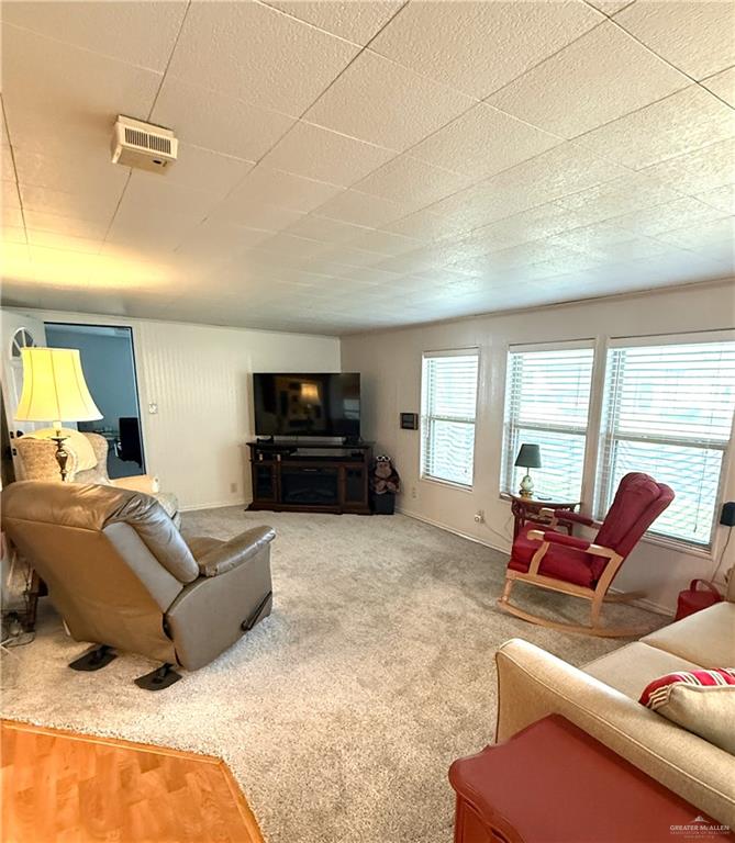 101 Rim Drive Mission, TX 78574 - Photo 3 of 17 a living room with furniture window and a flat screen tv