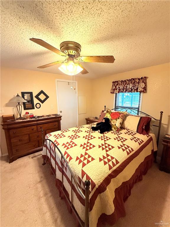 101 Rim Drive Mission, TX 78574 - Photo 9 of 17 a bed room with a bed and dresser