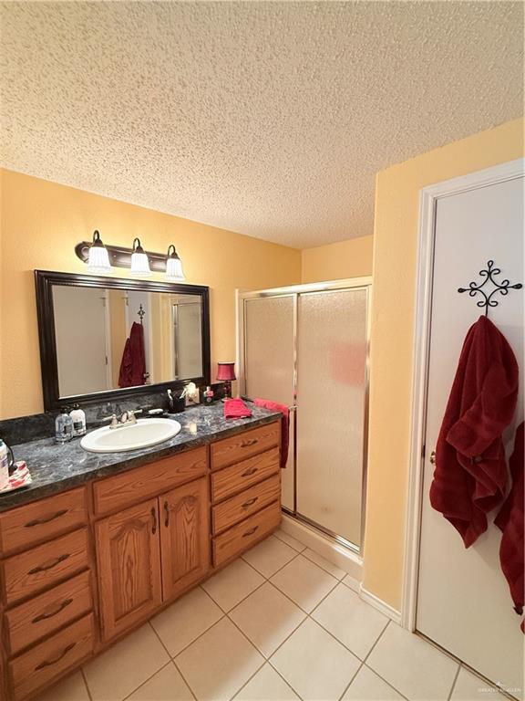 101 Rim Drive Mission, TX 78574 - Photo 10 of 17 a bathroom with a sink and a mirror