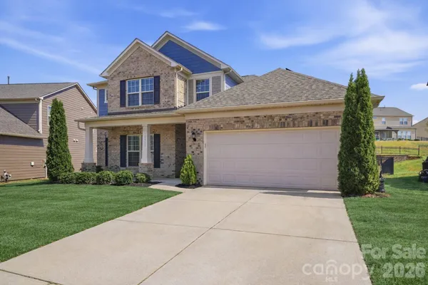 front view of a house with a yard