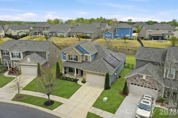 an aerial view of a house with a garden