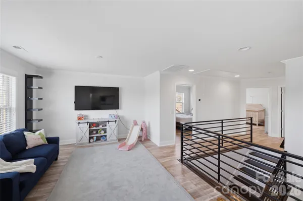 a view of a bedroom from a hallway