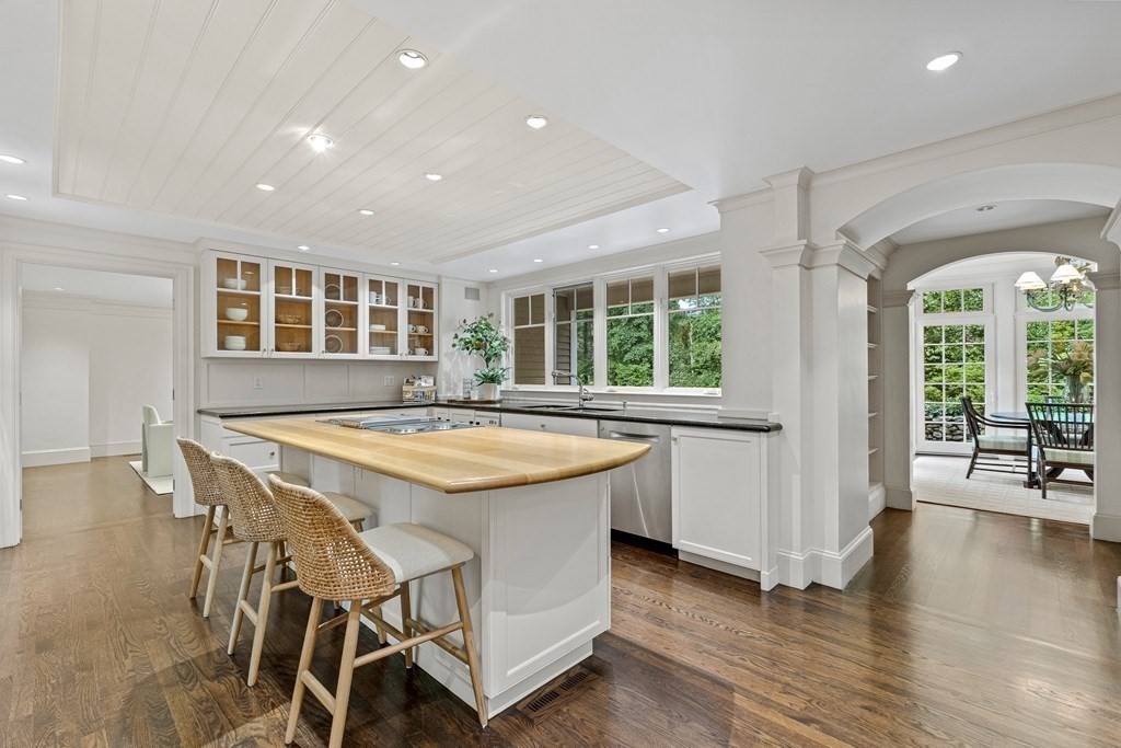 211 Meadowbrook Road Weston, MA 02493 - Photo 13 of 41 a dining hall with stainless steel appliances granite countertop a stove and a refrigerator