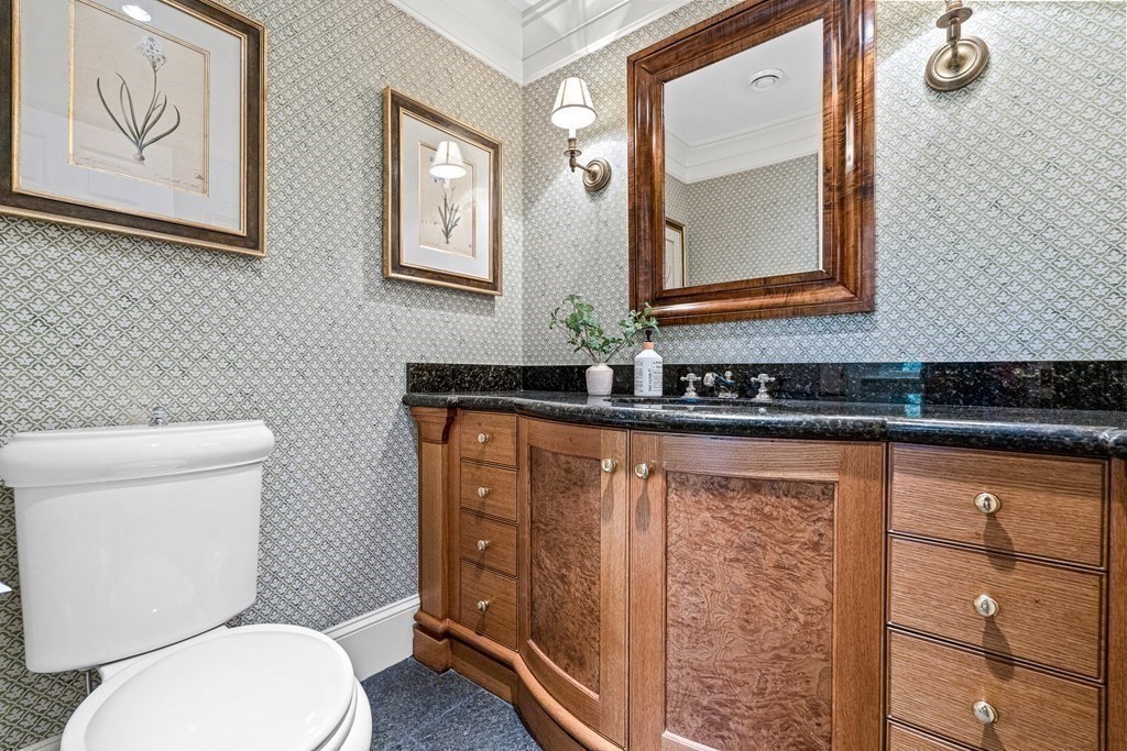 211 Meadowbrook Road Weston, MA 02493 - Photo 18 of 41 a bathroom with a toilet a sink and mirror