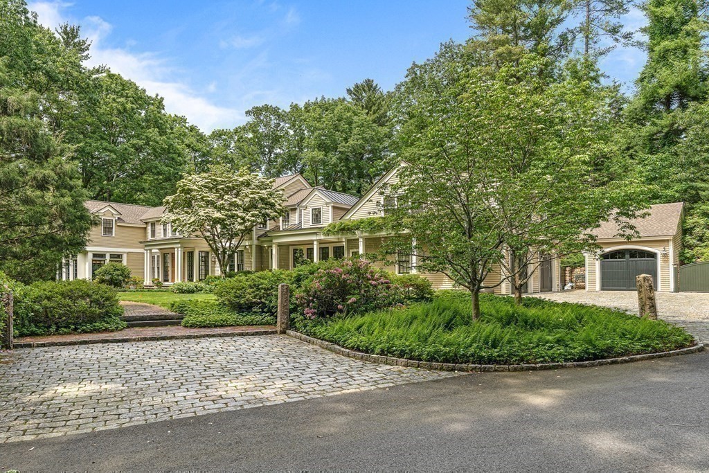211 Meadowbrook Road Weston, MA 02493 - Photo 2 of 41 a front view of a house with a garden