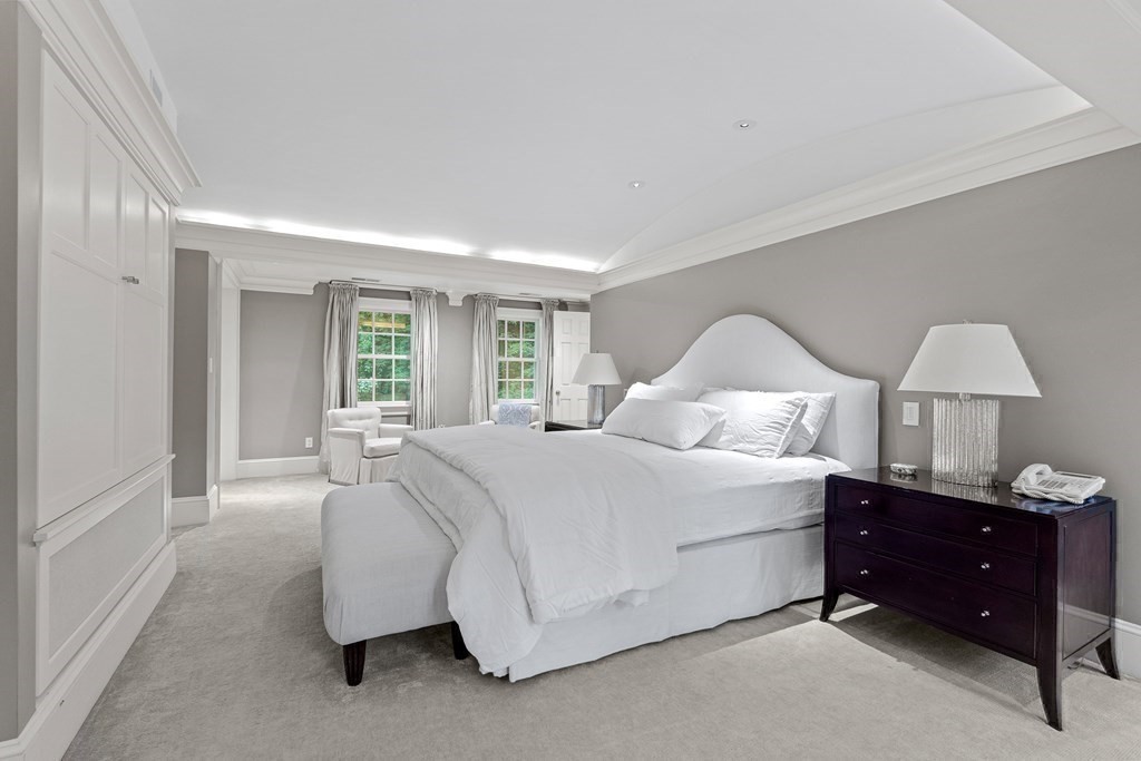 211 Meadowbrook Road Weston, MA 02493 - Photo 25 of 41 a spacious bedroom with a bed and a window