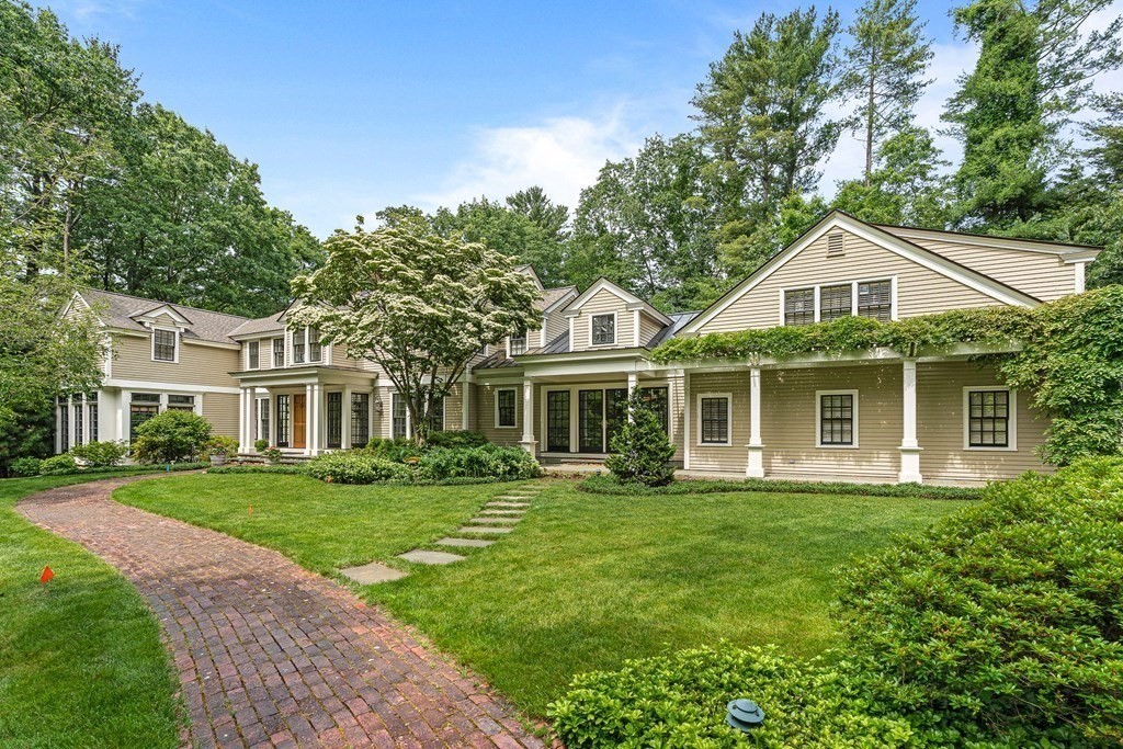 211 Meadowbrook Road Weston, MA 02493 - Photo 3 of 41 a front view of a house with a garden