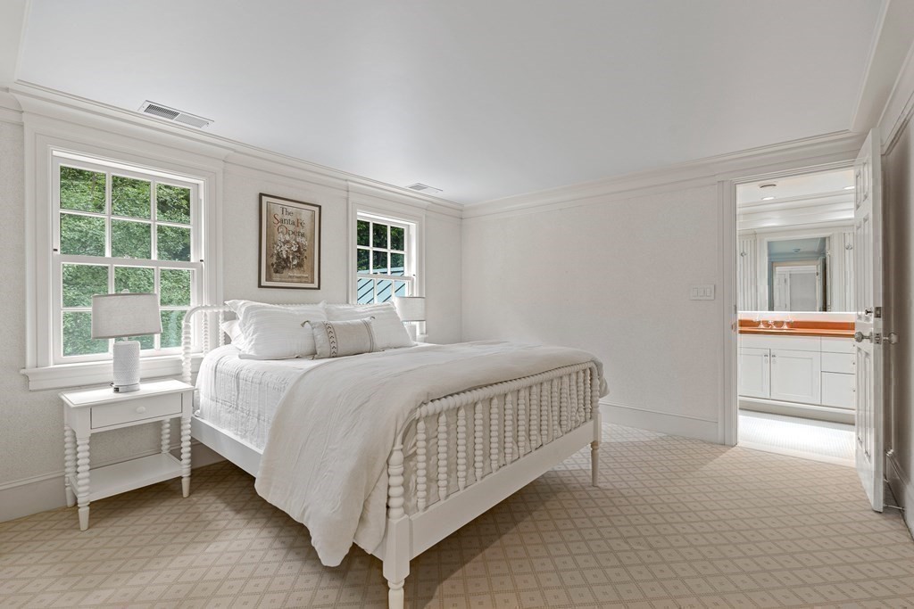 211 Meadowbrook Road Weston, MA 02493 - Photo 31 of 41 a bedroom with a bed and a table