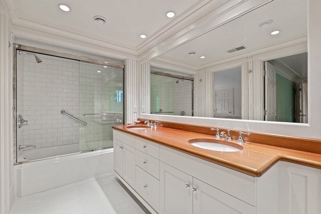 211 Meadowbrook Road Weston, MA 02493 - Photo 32 of 41 a spacious bathroom with a shower a sink and a mirror