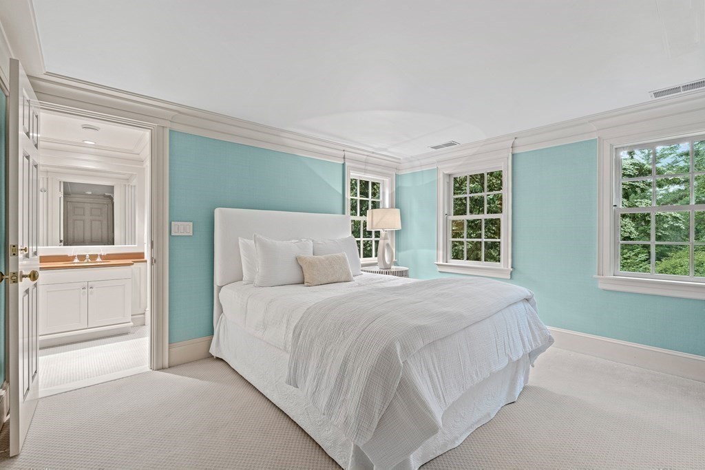 211 Meadowbrook Road Weston, MA 02493 - Photo 33 of 41 a bedroom with a large bed and a window
