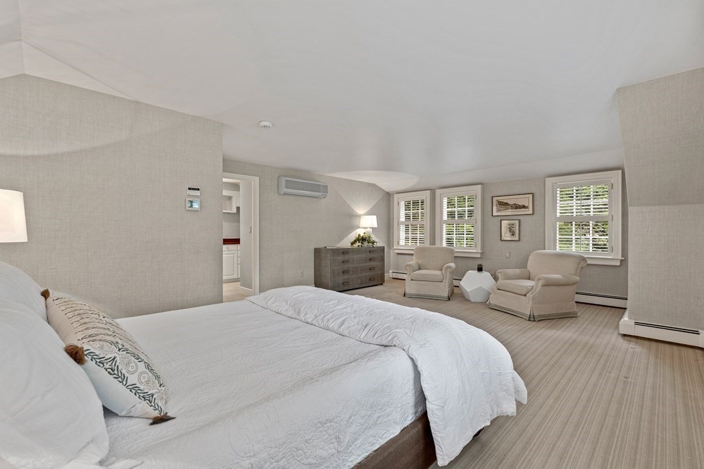 211 Meadowbrook Road Weston, MA 02493 - Photo 34 of 41 a bedroom with a bed and wooden floor