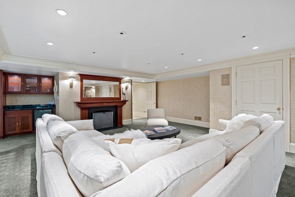 211 Meadowbrook Road Weston, MA 02493 - Photo 35 of 41 a living room with furniture and a wooden floor