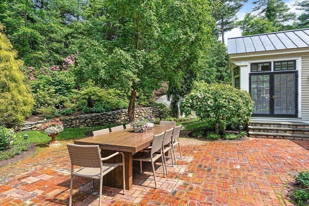 211 Meadowbrook Road Weston, MA 02493 - Photo 38 of 41 a view of a patio with table and chairs and potted plants