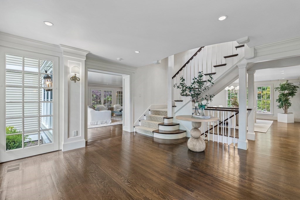211 Meadowbrook Road Weston, MA 02493 - Photo 5 of 41 a living room with couches chairs and with outer view with wooden floor