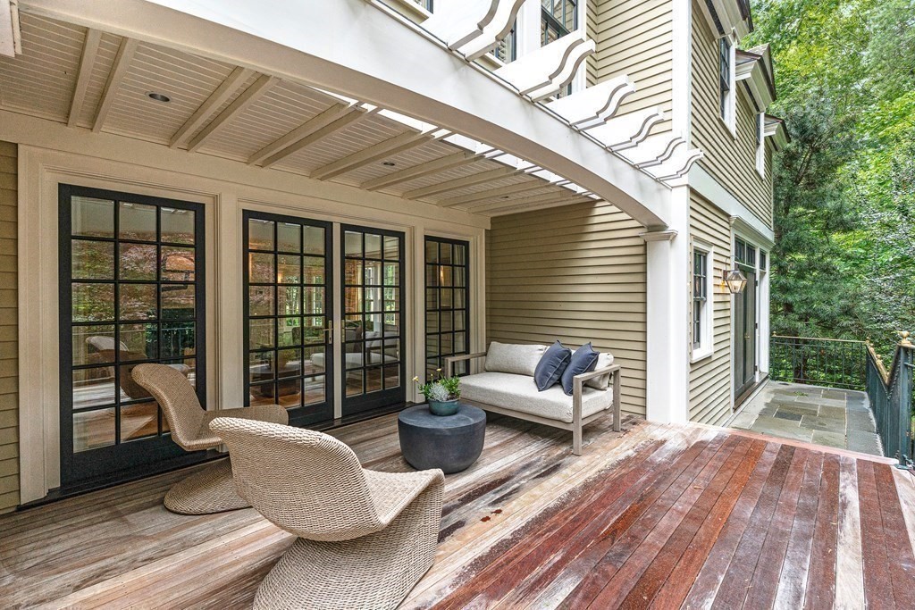 211 Meadowbrook Road Weston, MA 02493 - Photo 9 of 41 a balcony with furniture and large windows