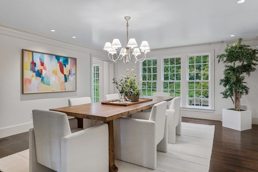 211 Meadowbrook Road Weston, MA 02493 - Photo 10 of 41 a view of a dining room with furniture a chandelier and wooden floor