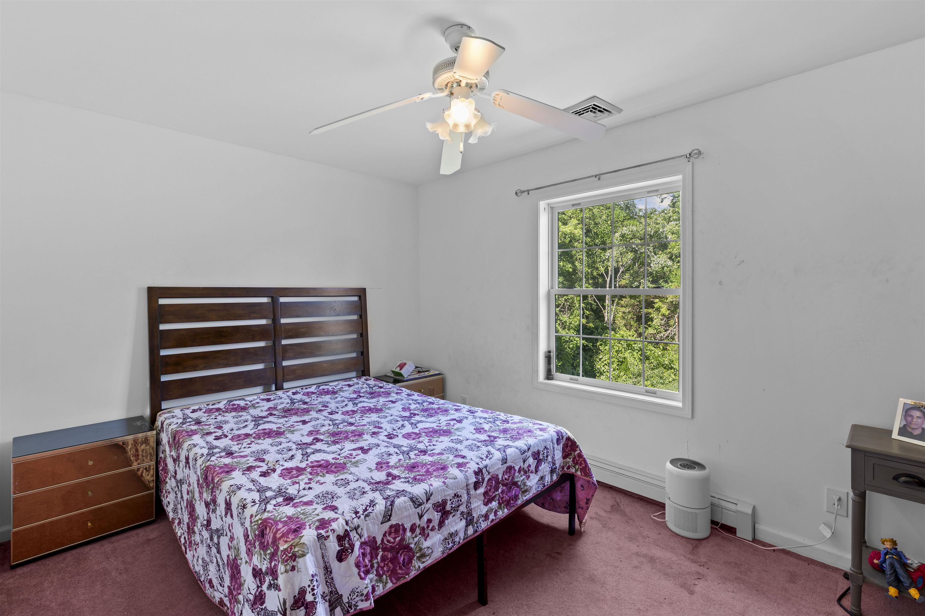 551 Shunpike Road Cape May Court House, NJ 08210 - Photo 25 of 47 a bedroom with a bed and a chandelier